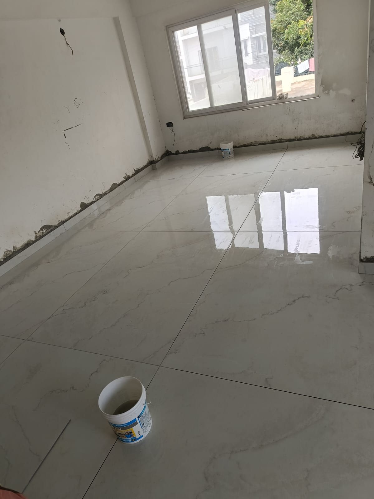 Polished floor tile installation and finishing